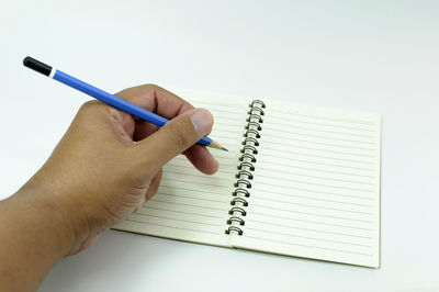 Close-up of hand holding book