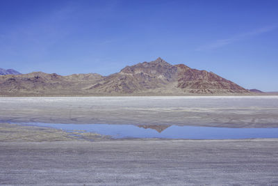 View of desert against mountain range