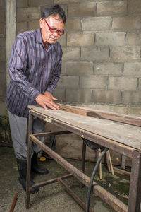 Carpenter working in carpentry workshop