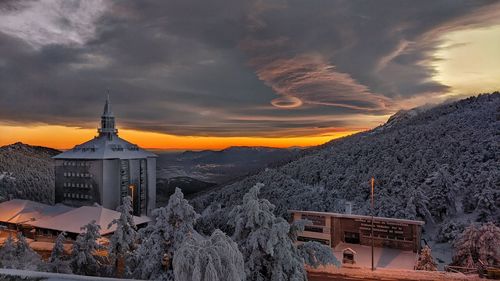 Scenic view of church against sky during sunset