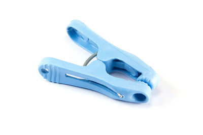 Close-up of blue clothespin on white background