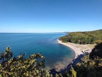 Scenic view of sea against clear blue sky