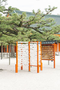 Built structure by trees against sky