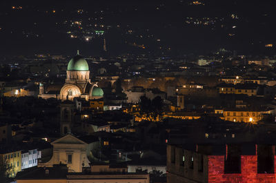 High angle view of illuminated buildings in city at night