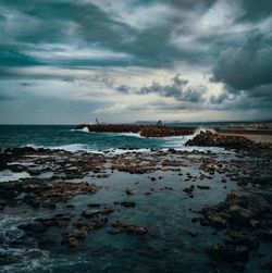 Scenic view of sea against sky at dusk