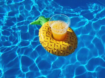 High angle view of lemon slice in swimming pool