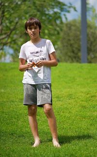 Full length of boy on grassy field