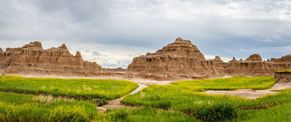 Panoramic view of rock formations on landscape against sky