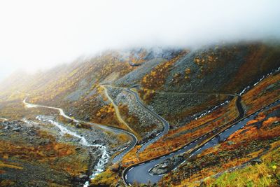 Aerial view of winding road through mountain