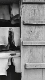 Close-up of towels drying by door