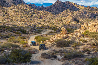 Car on road amidst desert