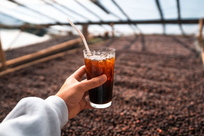 Close-up of hand holding drink