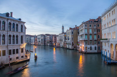 View of buildings in city at dusk