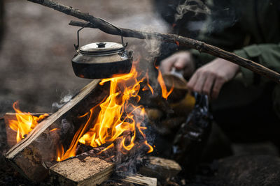 Kettle over log fire