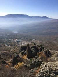 Scenic view of landscape and mountains against sky