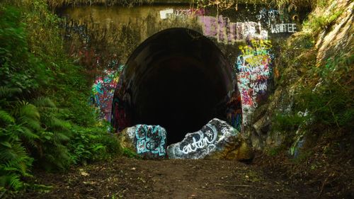 Graffiti on wall in tunnel