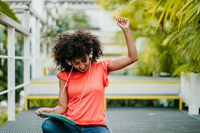 Portrait of woman sitting outdoors