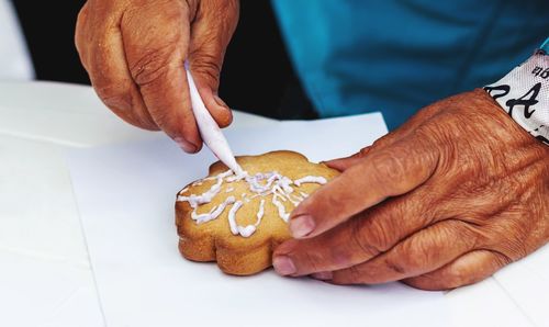 Close-up of man holding ice cream