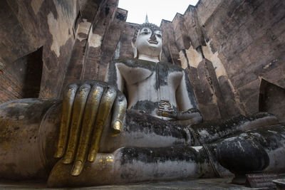 Low angle view of buddha statue