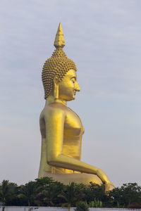 Low angle view of statue against sky