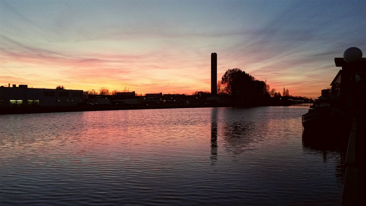 sunset, water, silhouette, sky, architecture, built structure, waterfront, reflection, building exterior, river, dusk, scenics, cloud - sky, tranquility, nature, tranquil scene, lake, orange color, cloud, beauty in nature