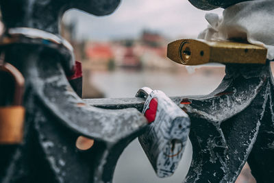 Close-up of bicycle hanging on metal