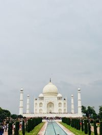 Taj mahal in city against sky