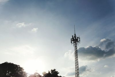 Low angle view of communications tower against sky