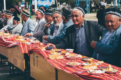 Group of people at market stall