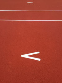 High angle view of arrow sign on road