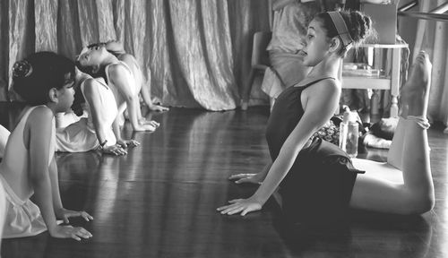 Students warm up before ballet practice
