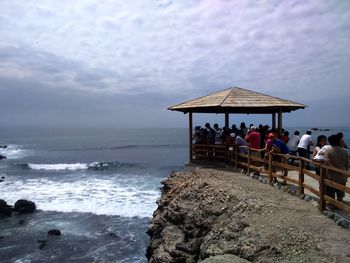 Scenic view of sea against cloudy sky