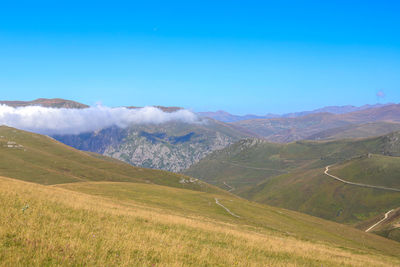 Scenic view of landscape against clear blue sky