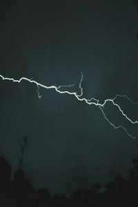 Low angle view of lightning in sky at night