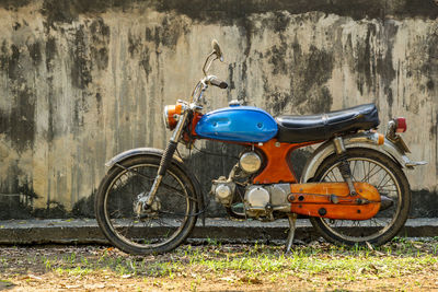 Bicycle parked against wall