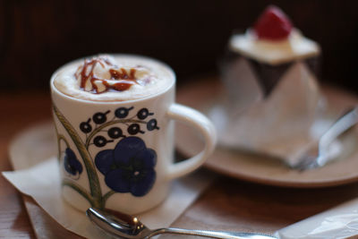 Close-up of coffee cup on table