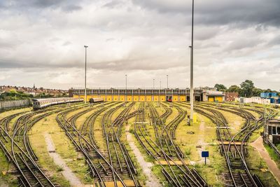 Train on railroad track against sky