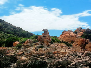 Rock formations on mountain against sky