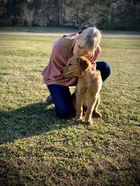 Man with dog on field