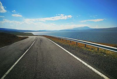 Empty road against sky