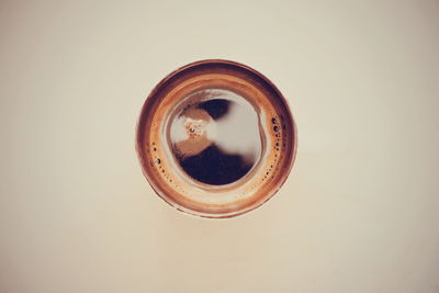 Close-up of coffee cup against black background