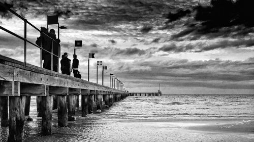 Man walking on road against sky