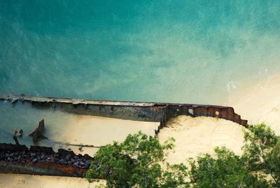 High angle view of abandoned swimming pool against sea