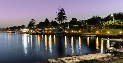 Scenic view of river against sky at night