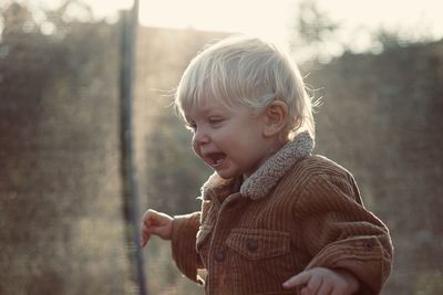 Portrait of cute boy looking away