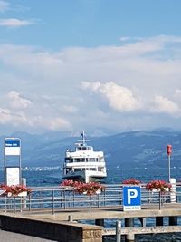 Ship moored on sea against sky