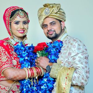 Portrait of couple against wall