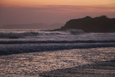 Scenic view of landscape against dramatic sky