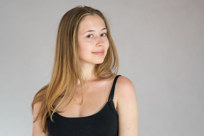 Portrait of a beautiful young woman over white background