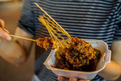 Close-up of hand holding food